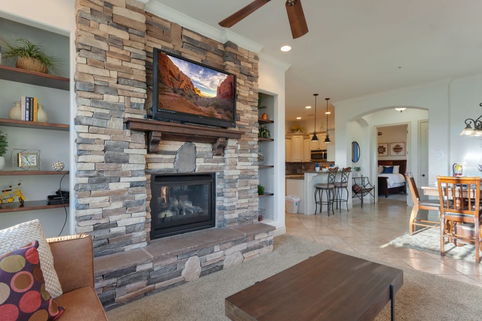 Living room, dining room, and kitchen, looking towards entrance to masters suite.