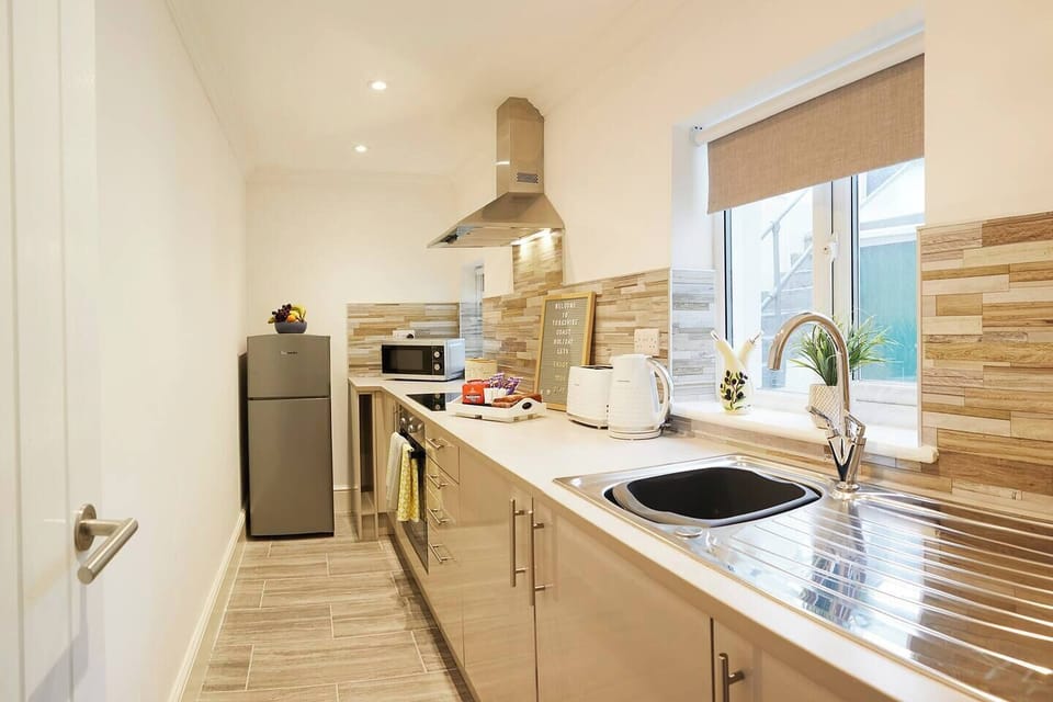 This is the kitchen. There is no kettle as the boiling water comes direct from the hot tap in kitchen. 