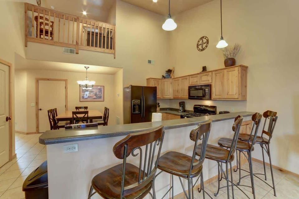 Kitchen opens to upper floor mezzanine balcony