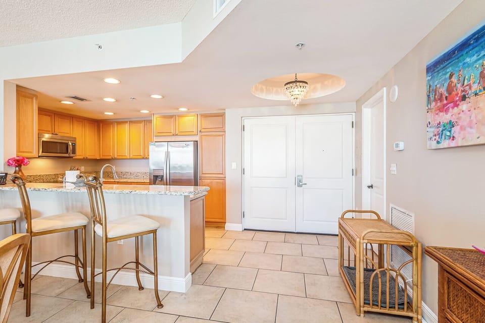 Bright, open layout flows from your entryway into a welcoming kitchen with granite counters, stainless steel appliances, and a breakfast bar perfect for morning coffee.