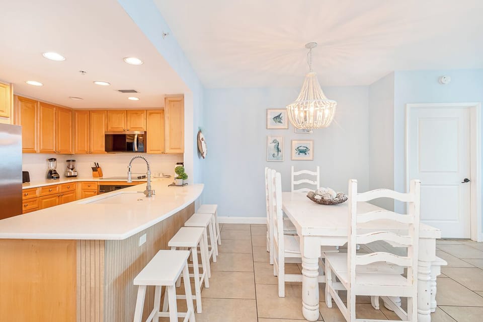 Your spacious open kitchen flows into a bright dining area, where you'll love preparing meals and gathering around the elegant white table.