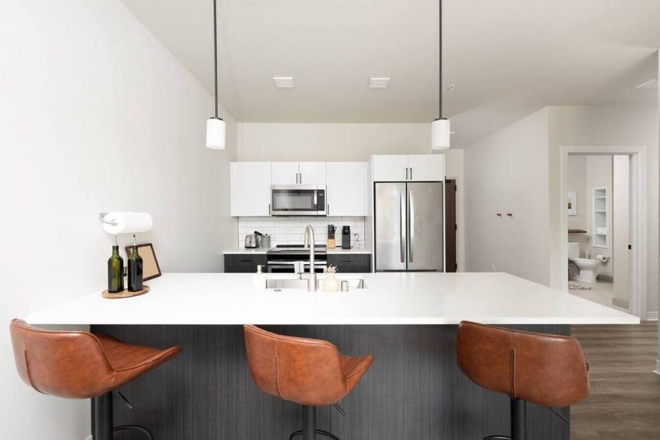 Whip up your favorite meals in this fully equipped, open-concept kitchen that flows seamlessly into the living area—perfect for socializing while you cook