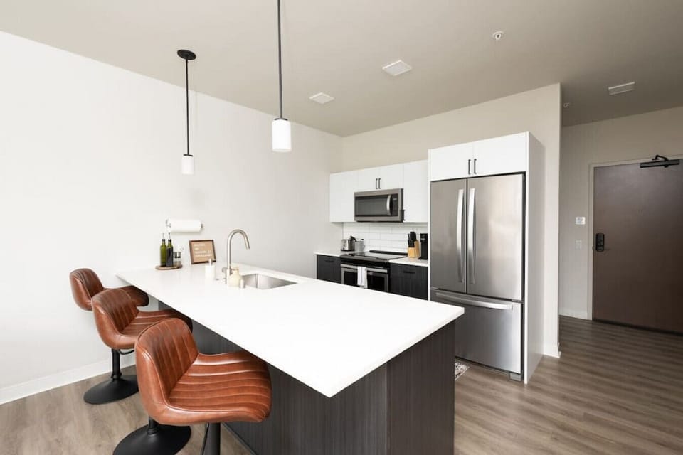 Whip up your favorite meals in this fully equipped, open-concept kitchen that flows seamlessly into the living area—perfect for socializing while you cook