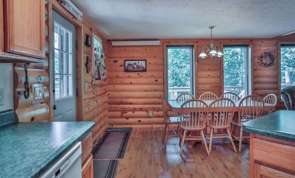 Dining area with natural wood log finish.