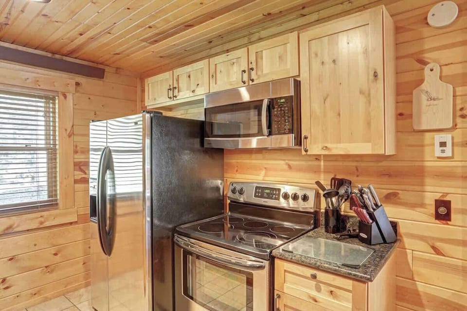 Fully equipped kitchen with beautiful wood cabinets. 