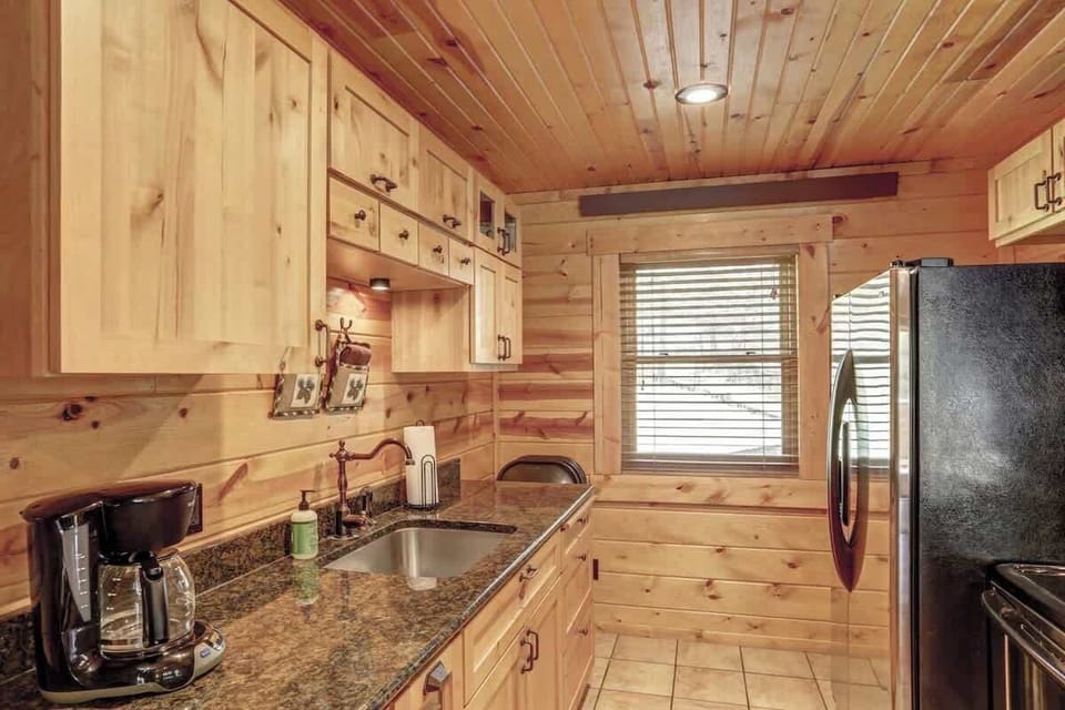 Fully equipped kitchen with tongue and  grove wood ceilings.