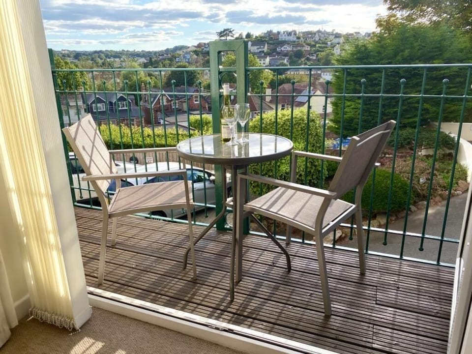 Close up of the balcony with views down to the park and sea to the left.
