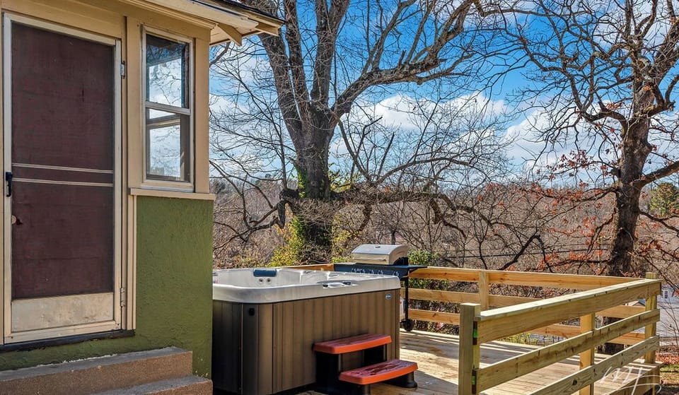 Hot tub and grill on private back deck overlooking the back yard