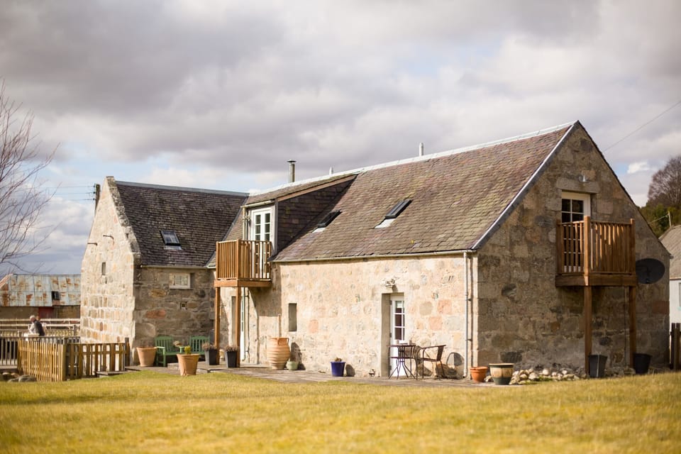 The exterior of The Maltings, holiday lodge in Nethy Bridge is set in a stunning location.