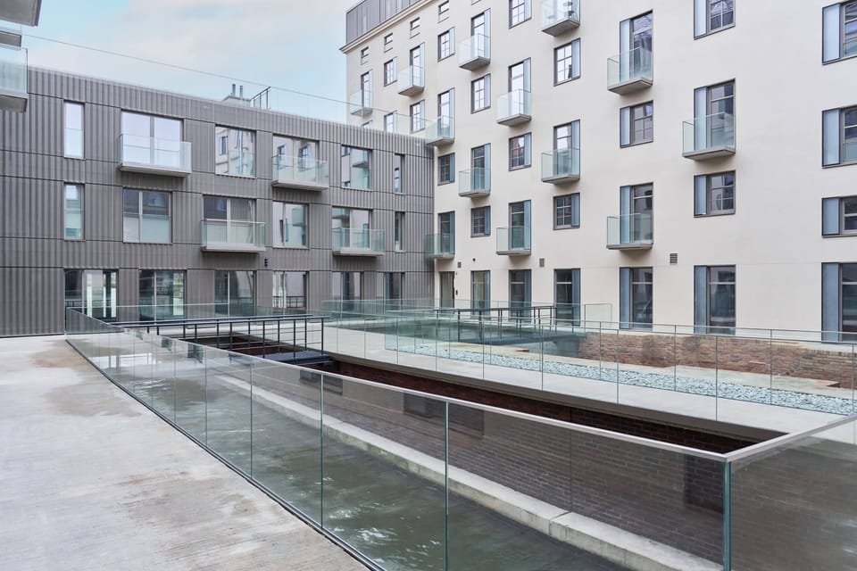 A closer view of the residential complex, featuring a clean and modern exterior.
