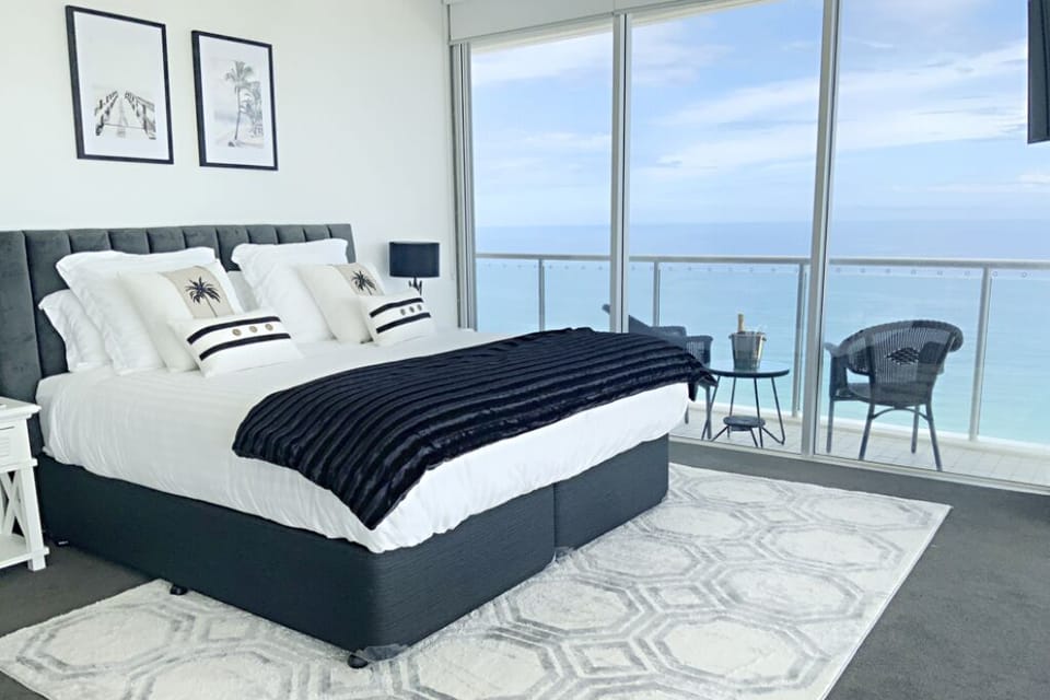 Primary Bedroom with beachfront views