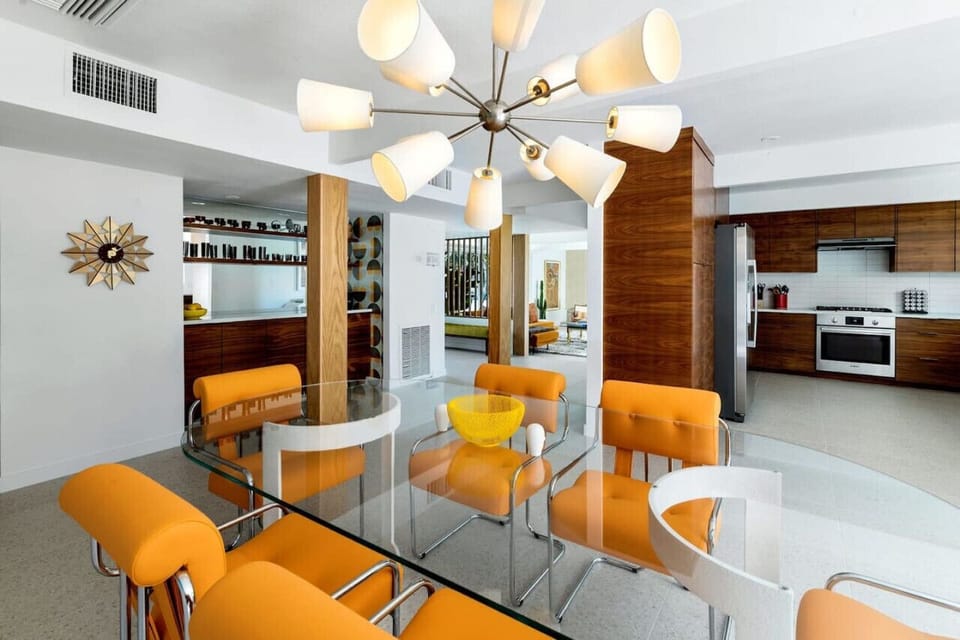 Dinner in style – glass, chrome, and wood blend seamlessly for a chic aesthetic.