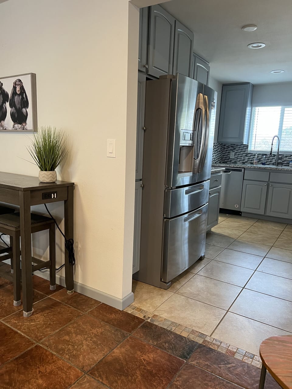 View of kitchen from dining/living room area