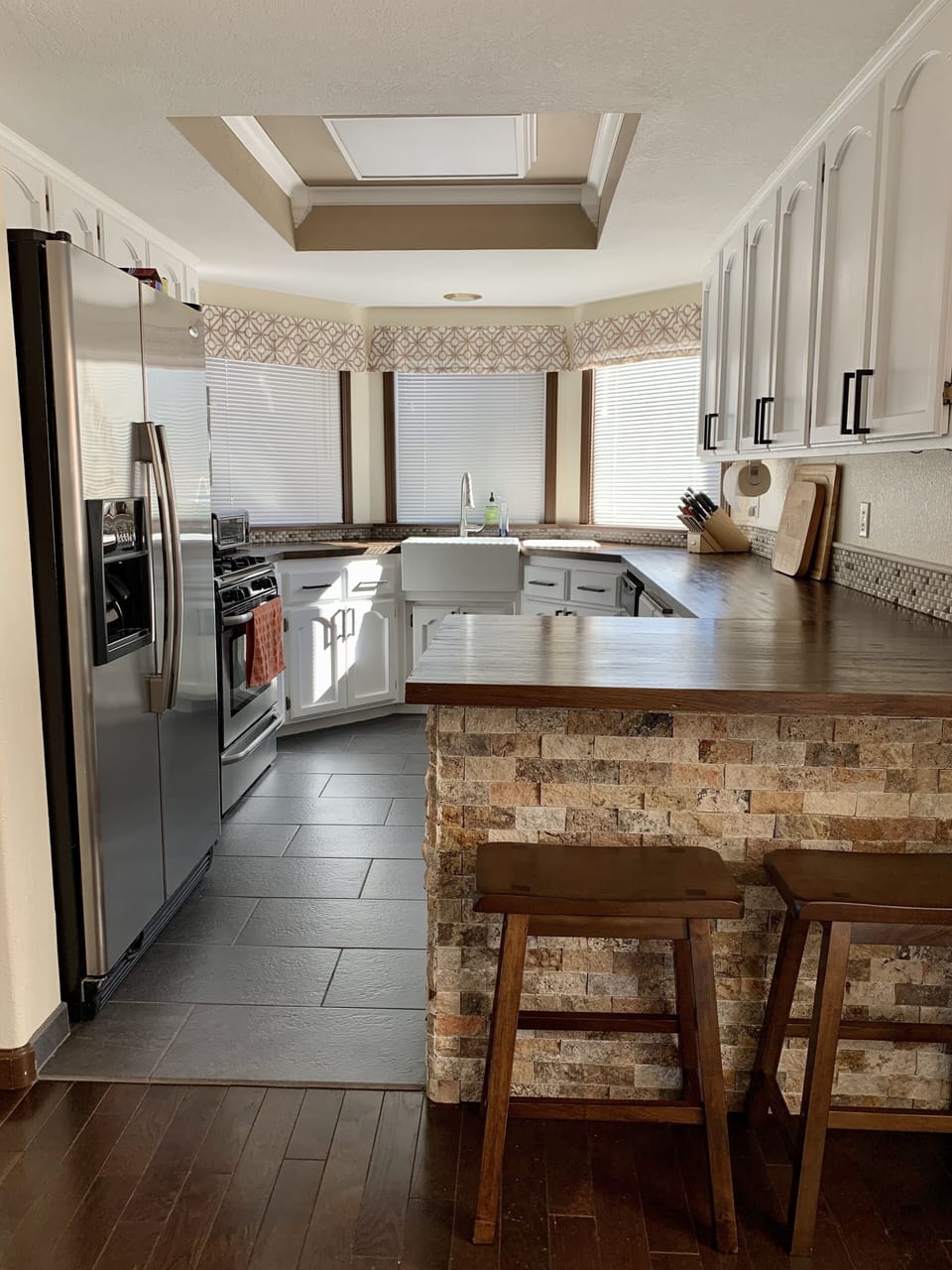 Gourmet kitchen with butcher block counters and farmhouse sink