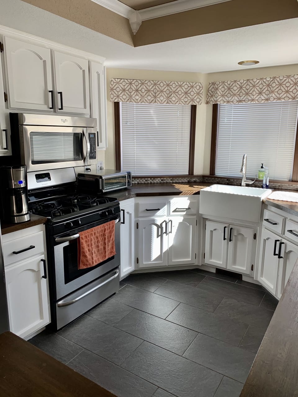 Gourmet kitchen with butcher block counters and farmhouse sink