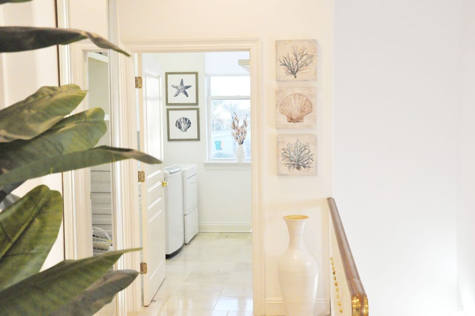 Laundry room with sink and built in ironing board.