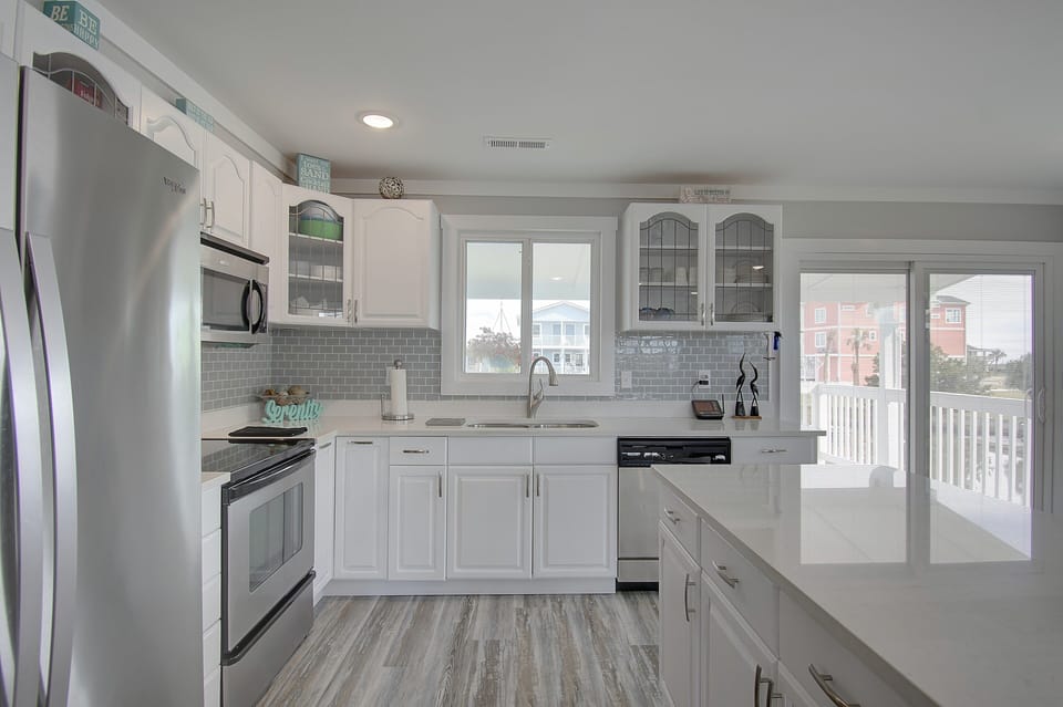 Large well appointed kitchen with stainless steel appliances