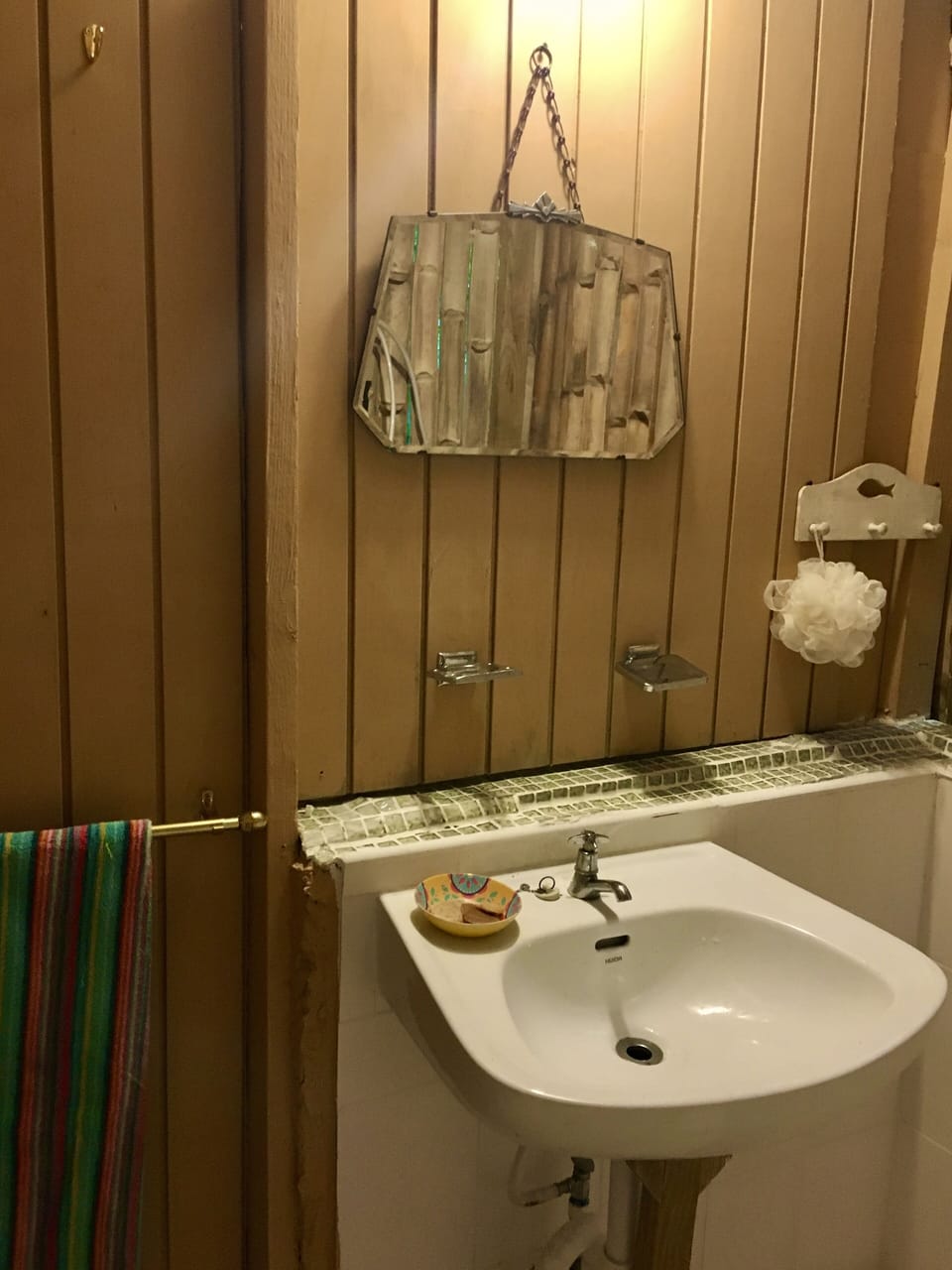 Rustic bathroom with shower, sink and toilet 