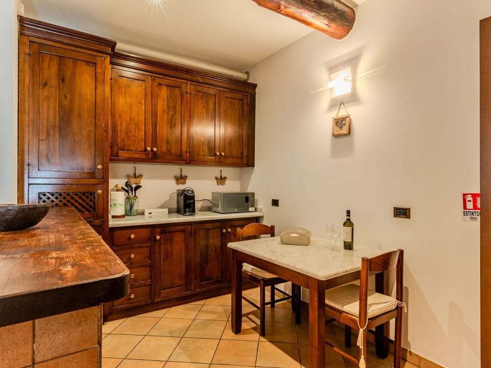 Furniture, Cabinetry, Interior Design, Countertop, Wood, Flooring, Kitchen, Ceiling, Cupboard, Room