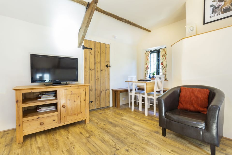 The dining room & lounge with TV/DVD & great views over the gardens
