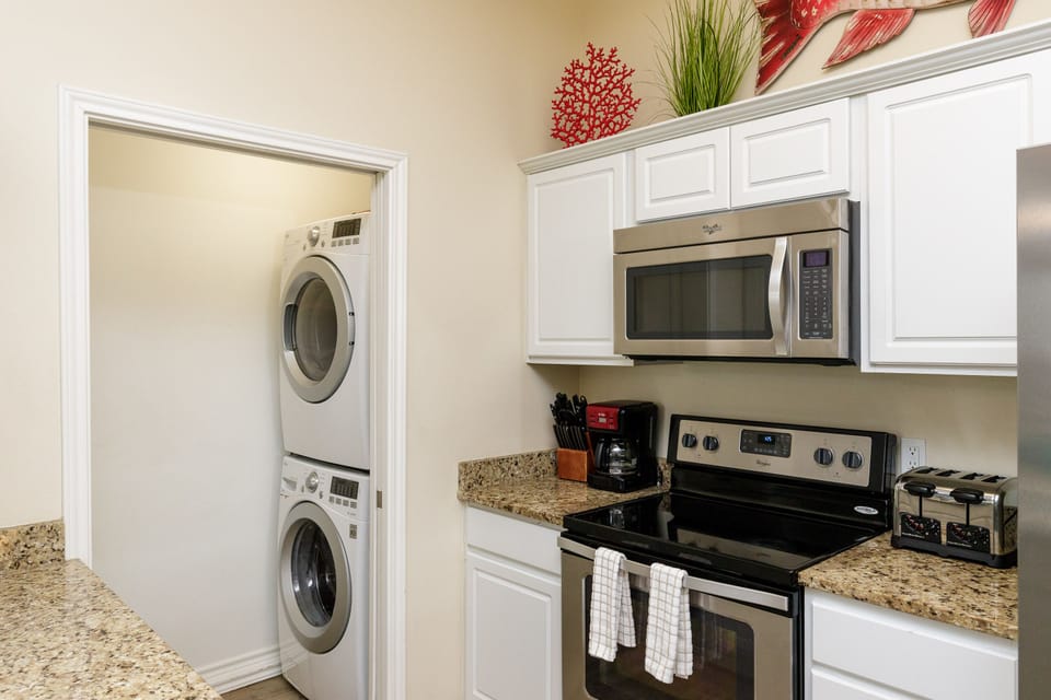 Your fully equipped kitchen features granite countertops, stainless appliances, and convenient in-unit laundry for ultimate comfort.