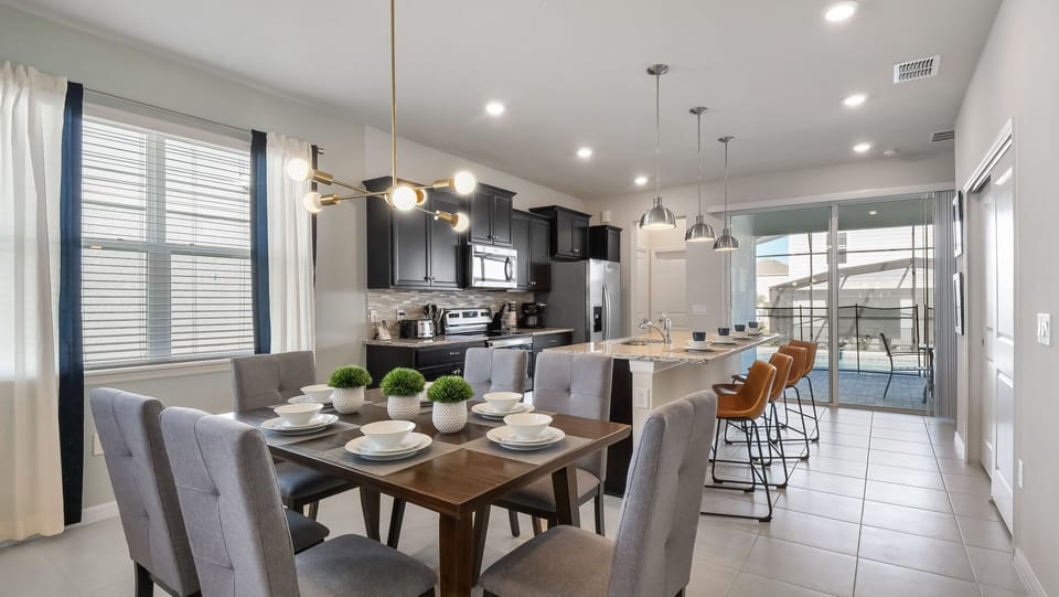 Dining area set for 6 and bar stool seating