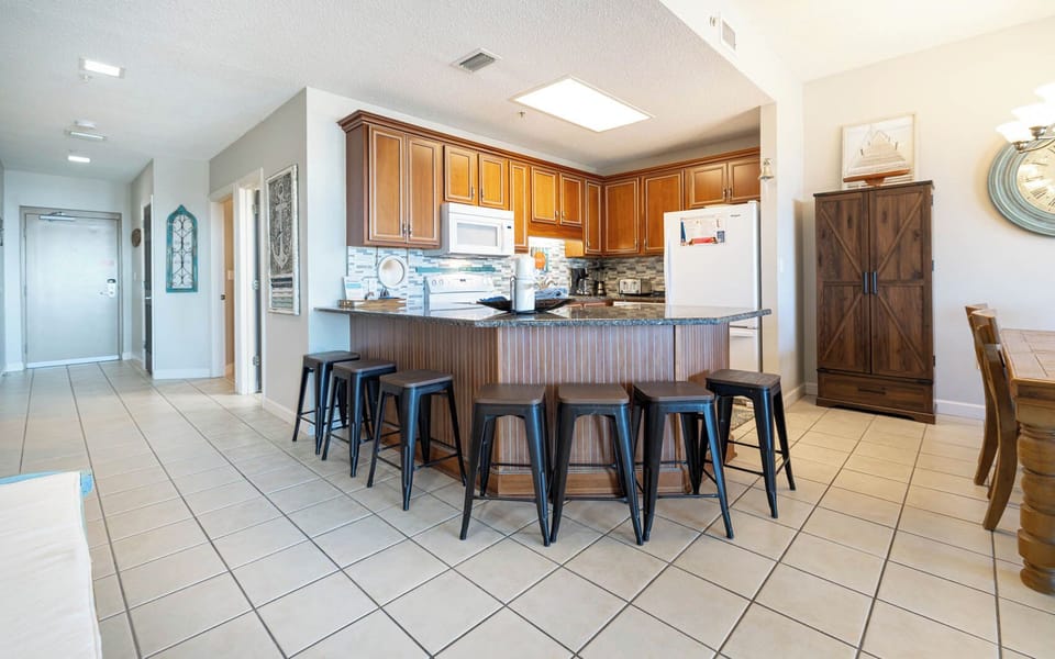 Enjoy meals at the stylish bar seating, with a view of the inviting kitchen and easy access to the dining area