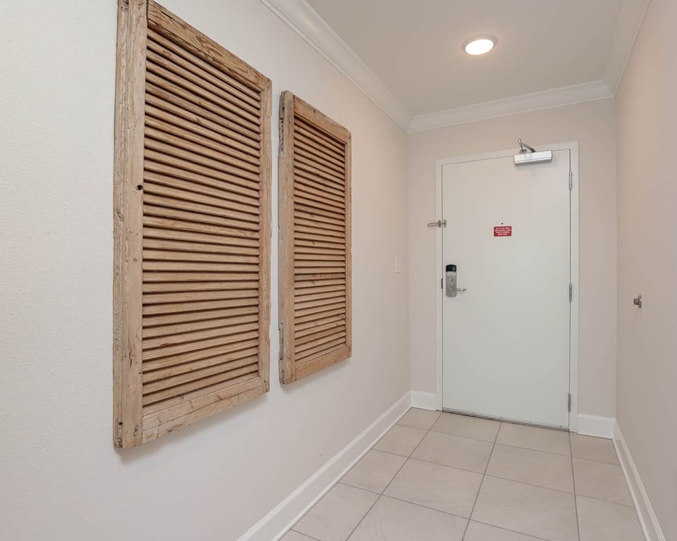 Step into a welcoming entryway adorned with unique decor, inviting you to begin your beach getaway