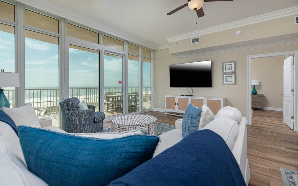 Experience relaxation in the cozy living space, enjoying your favorite shows while catching coastal breezes