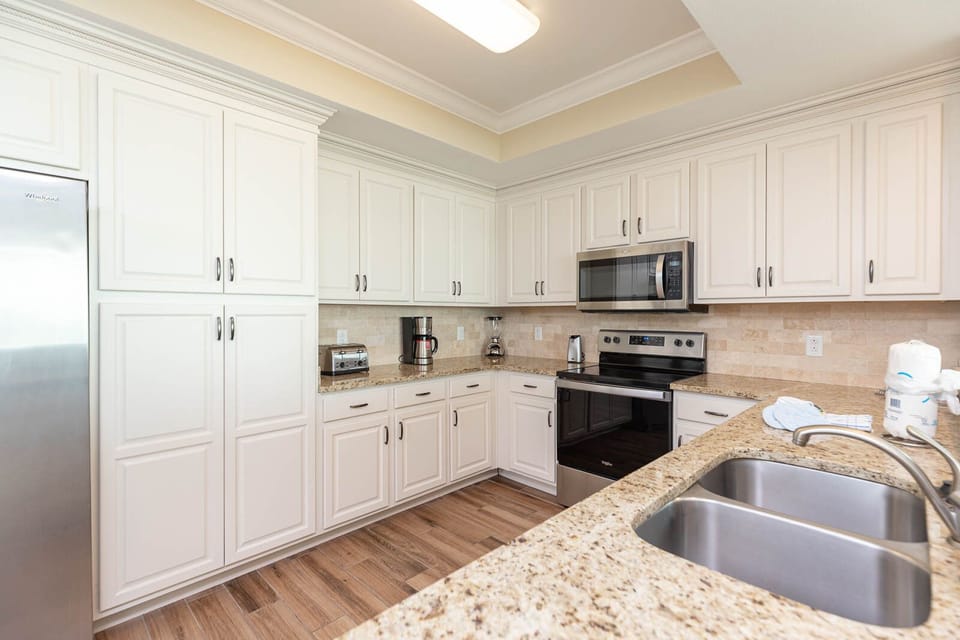 Cook and create delightful meals in the kitchen with sleek countertops and stainless appliances