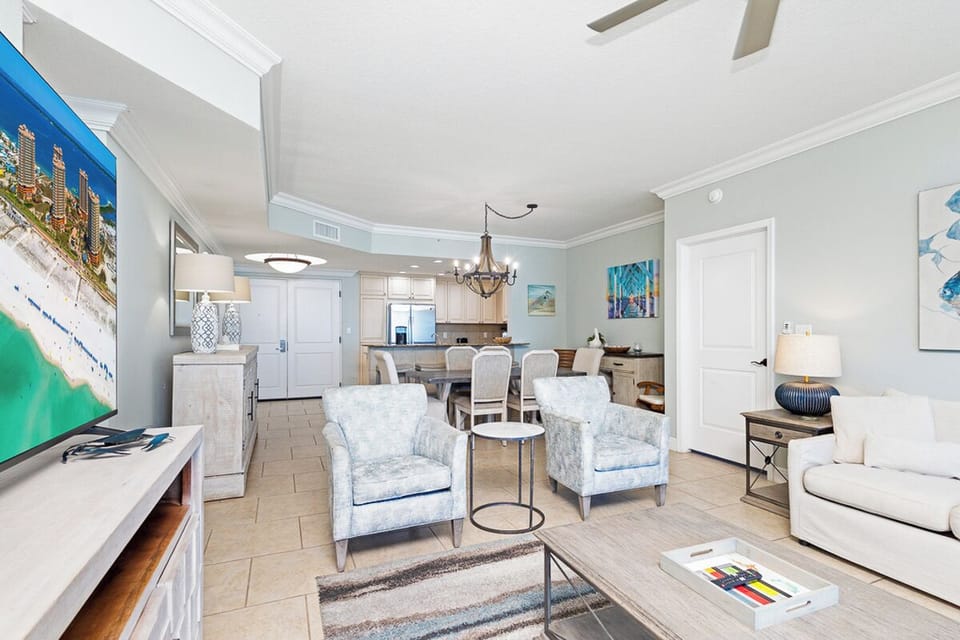 Step into your bright, open living space where coastal elegance meets home comfort. Sink into plush seating, gather around the dining table, and feel the flow of this thoughtfully designed retreat—your perfect spot to unwind after a day by the shore.