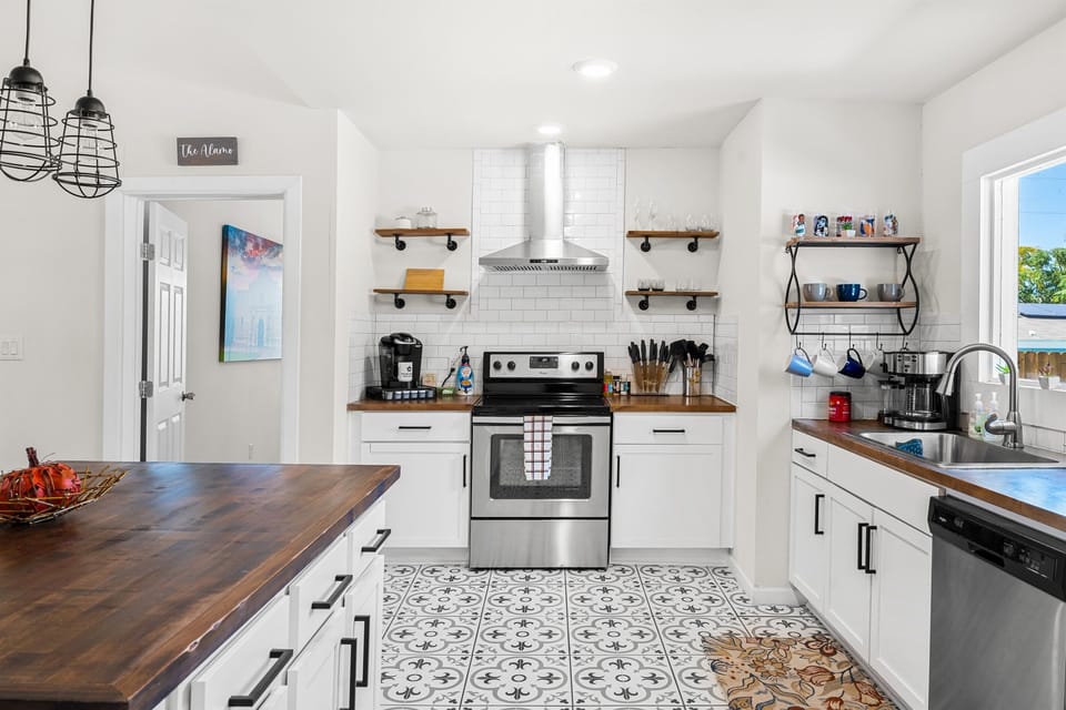 The modern kitchen is well stocked to provide anything you might need to cook a delicious meal, finished with stainless steel appliances.