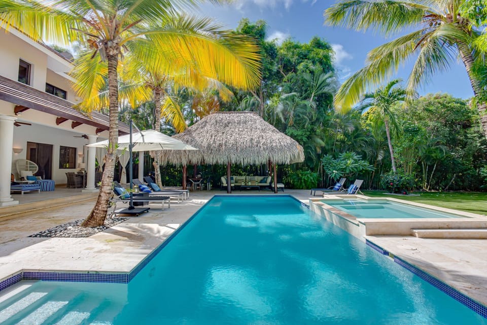 Extensive pool with hot tub, outdoor living, bbq, cabana and garden