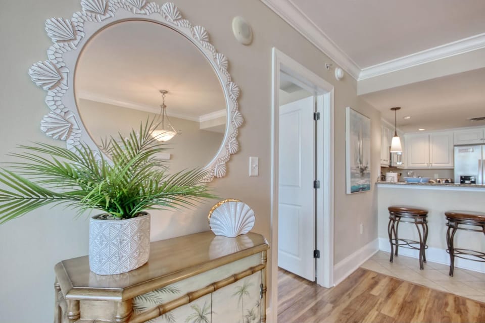 Bright and airy entryway leading to a cozy open kitchen