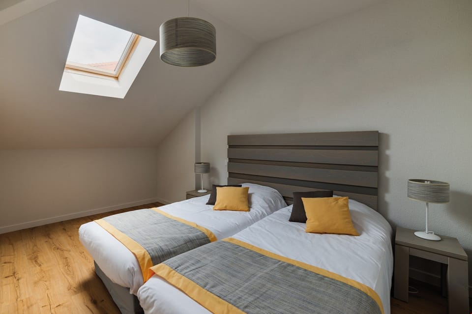 Get a peaceful night sleep in our cozy bedroom. Bedding configurations vary.