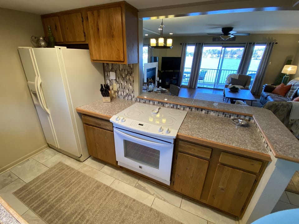Kitchen opens up to the living room and awesome lake views. 
