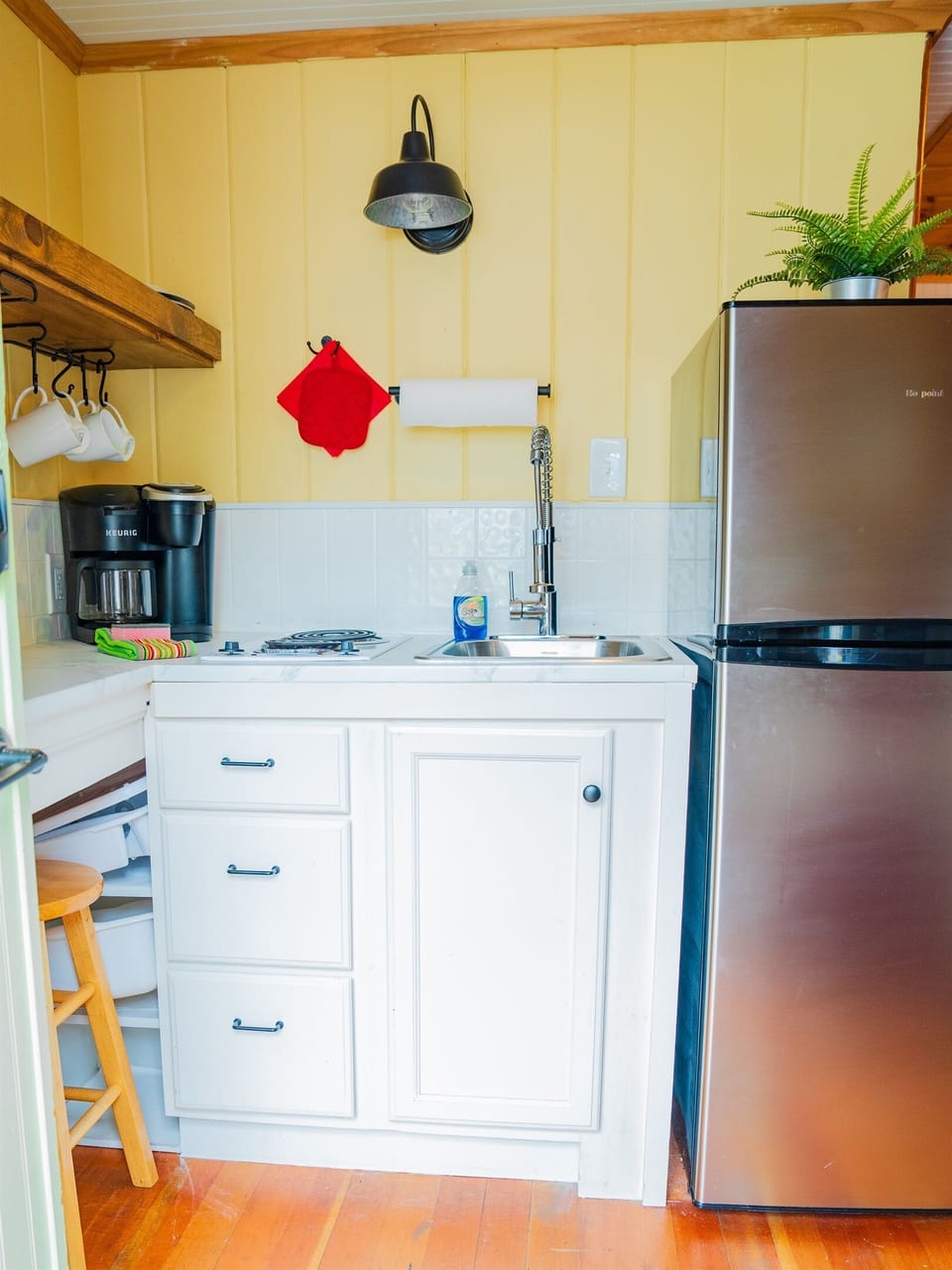 Kitchenette w/ 2 burner stovetop, refrigerator and toaster oven.