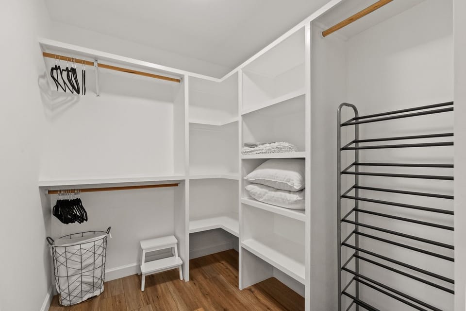 Walk in closet in the primary bedroom.