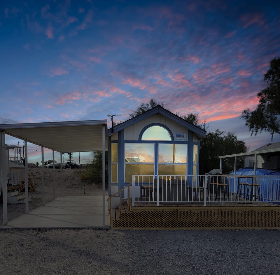 Exterior of Cottage with Firepit, Benches and 4-person Bistro Table to enjoy vie