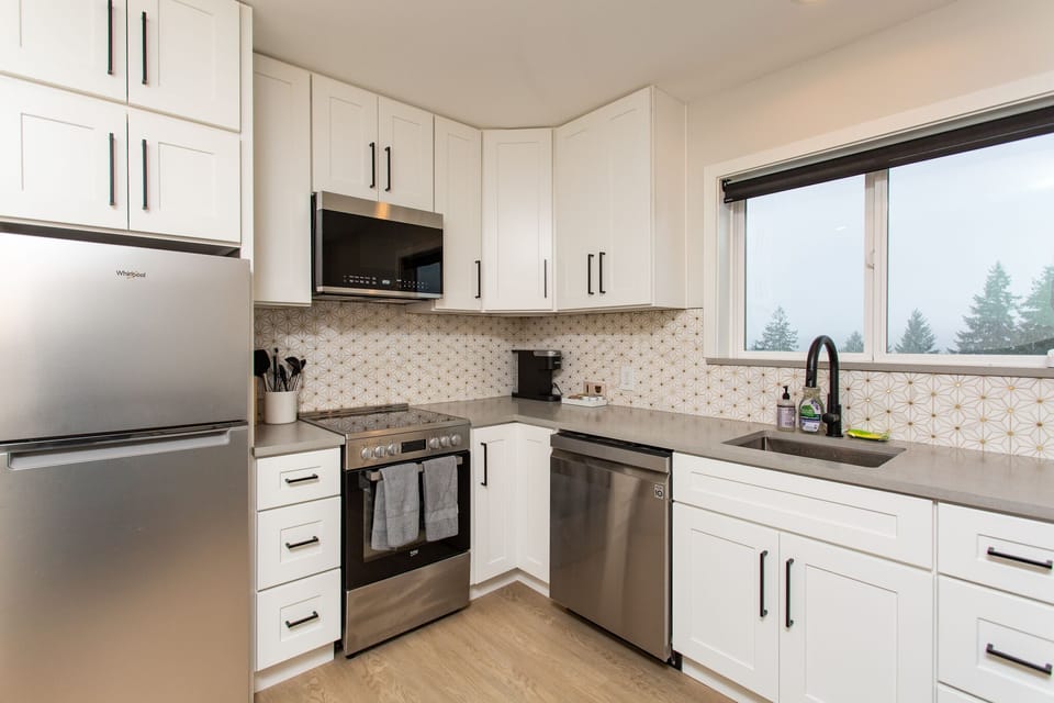 Full stainless steel appliance stack available for guest use.