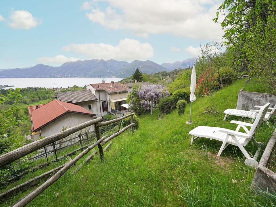 Cloud, Sky, Plant, Mountain, Natural Landscape, Land Lot, Table, Grass, Building, Outdoor Furniture