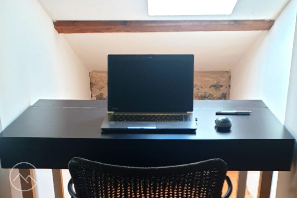 Work from home in our office in the loft. WiFi, bright space & velux window.