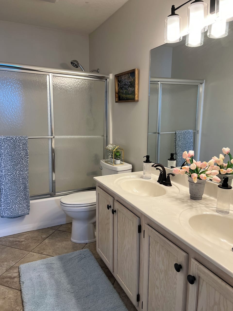 Master shower/ tub new lighting & double sinks linens hand soap & tp provided