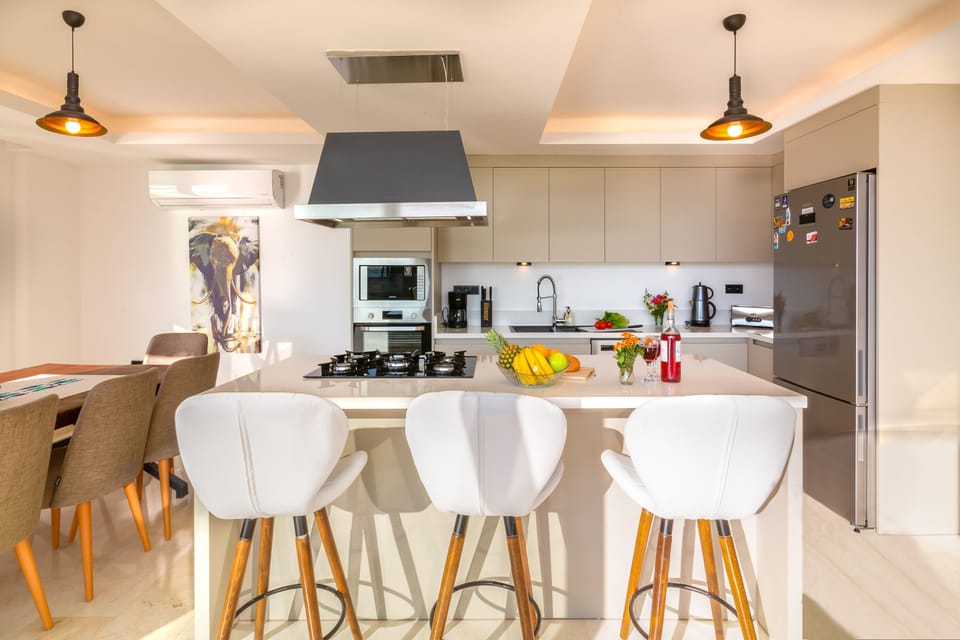 Open plan fully fitted kitchen with an island unit