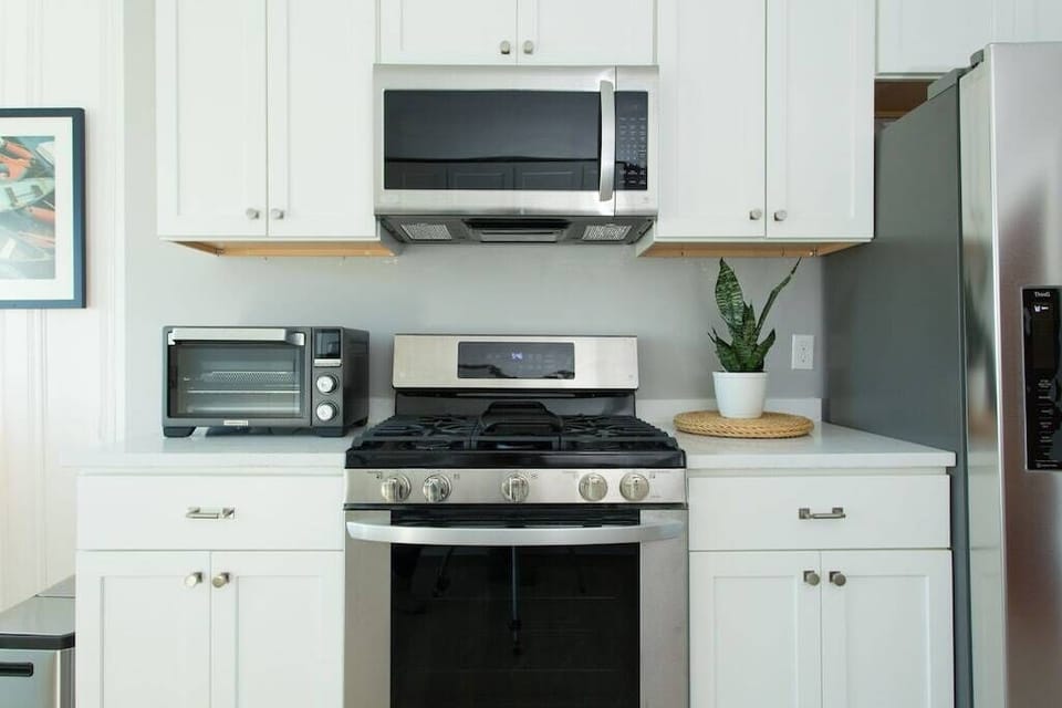 Kitchen: Modern appliances and sleek design await your culinary adventures!