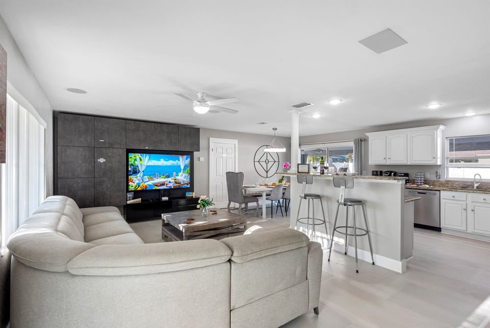 Our spacious living room, featuring a plush and contemporary couch, guarantees a fantastic experience for all our guests.