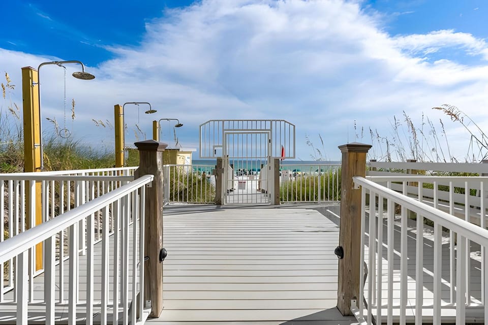Our Boardwalk - your gateway to sun, sand, surf, and memories. Outdoor showers.
