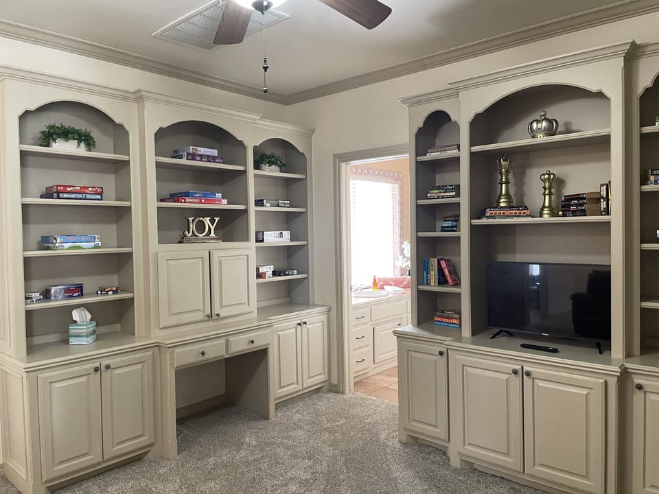 Upstairs game room includes a variety of games, puzzles & smart tv