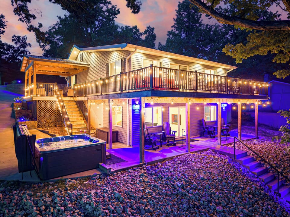 This cozy home has it all! A private hot tub, dock, 2 fire pits and a game room!