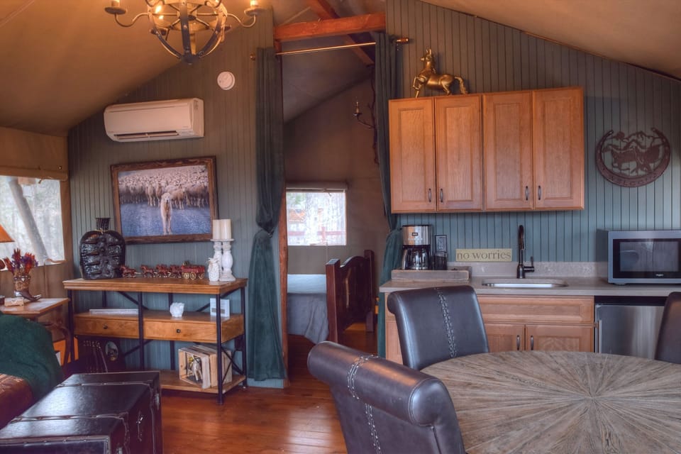 A well stocked kitchenette with microwave, fridge, coffee maker & dishware. 
